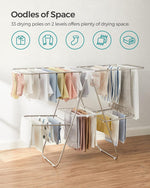 Clothes Drying Rack, Foldable 2-Level Laundry Drying Rack, Free-Standing Large Drying Rack, with Height-Adjustable Wings, 33 Drying Rails, Sock Clips, Silver and White ULLR053W01